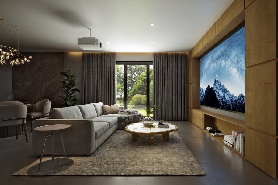 A media room featuring a large screen and comfy seating.