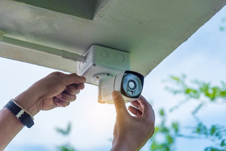 A smart surveillance camera being installed.